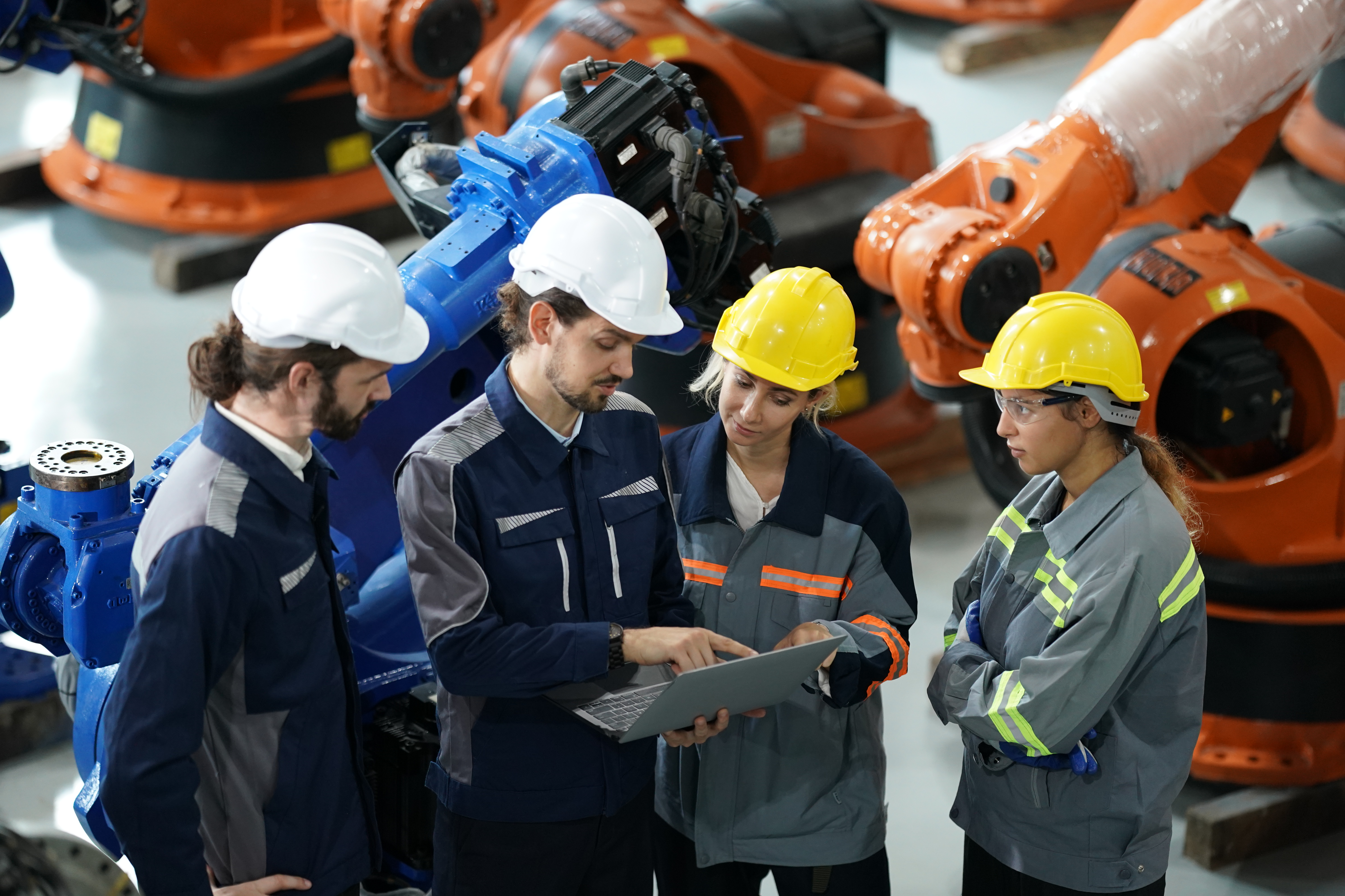 Engineers operating robotic machinery